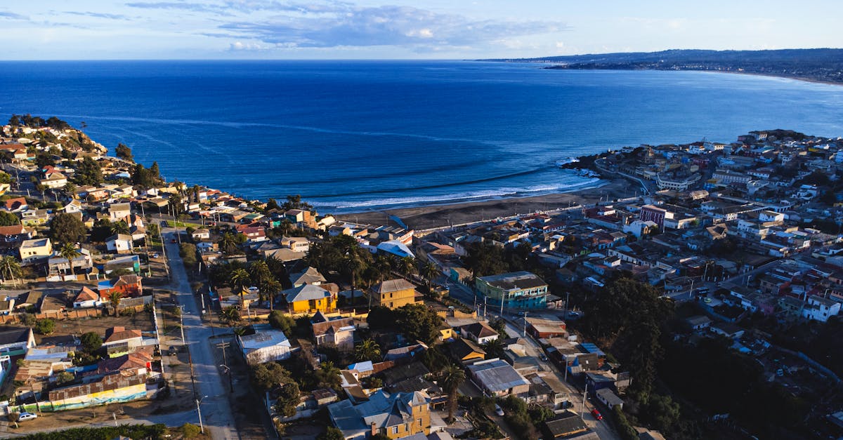 Aerial view capturing beautiful coastal Cartagena with houses, beach, and ocean.