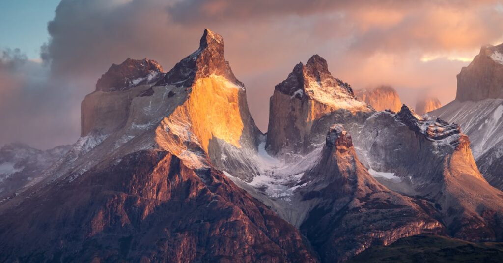 Breathtaking view of snowcapped mountains during sunset in Torres del Paine, Patagonia, Chile.